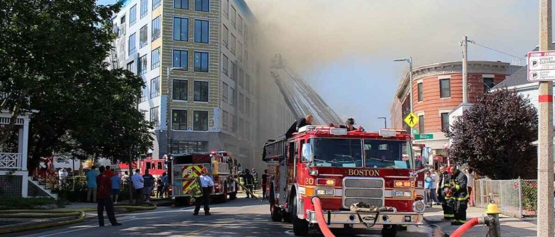 a rescue team strugle to control on fire emergency